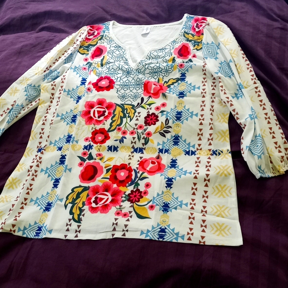 Silk screened new 3/4 length sleeve. Good for tall ladies.